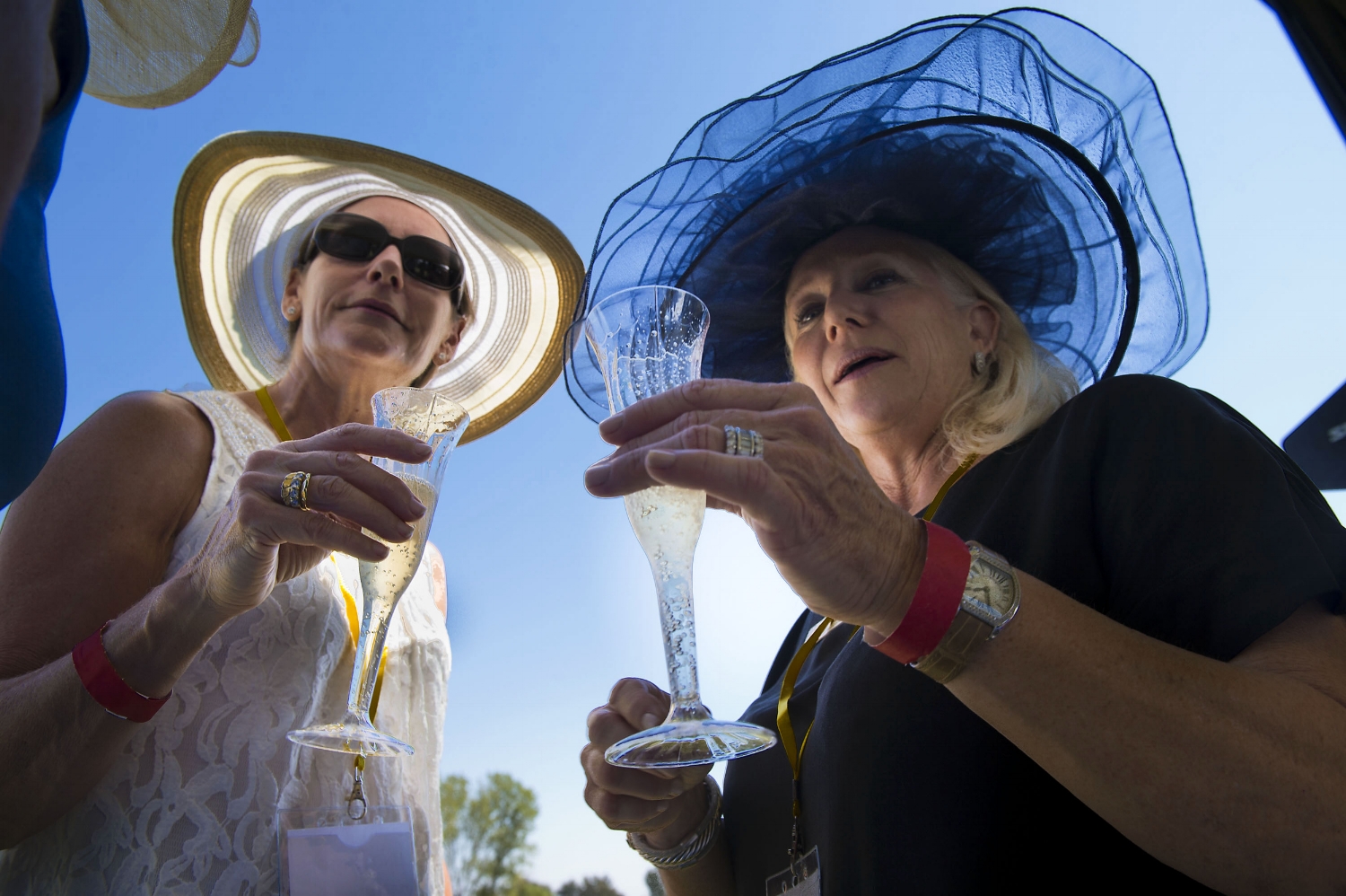  Linda Lasher, left, and Shari Lasher enjoy a glass of Champagne during a polo match at Chamberlain Ranch in Wilton on Saturday, September 14, 2013. 