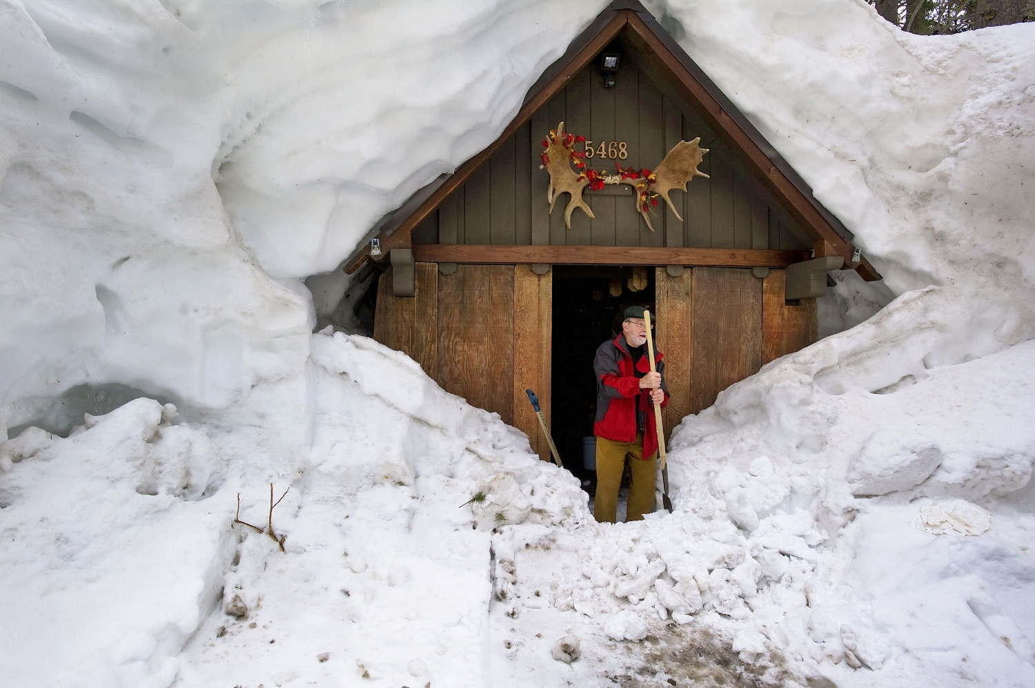 Cliff Raisbeck prepares to clear snow from in front of his front door at Serene Lakes near Truckee on Monday, April 11, 2011.
