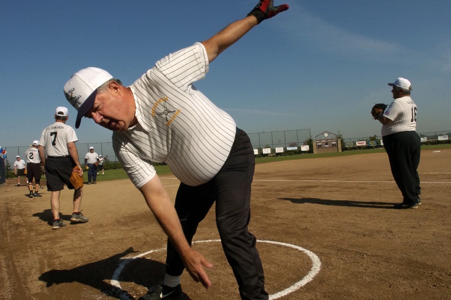  2nd baseman John Klea stretches out just prior to the opening game of the Lincoln Hills Senior Softball season at Sun City Lincoln Hills on Wednesday April 7, 2004. 