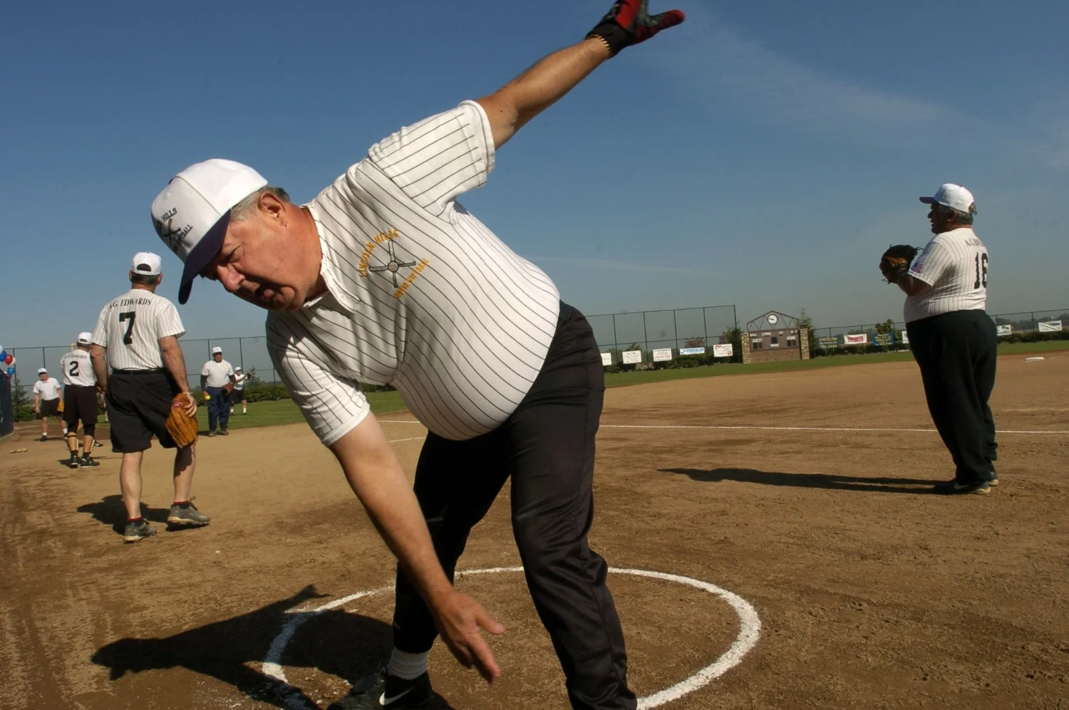 2nd baseman John Klea stretches out just prior to the opening game of the Lincoln Hills Senior Softball season at Sun City Lincoln Hills on Wednesday April 7, 2004.