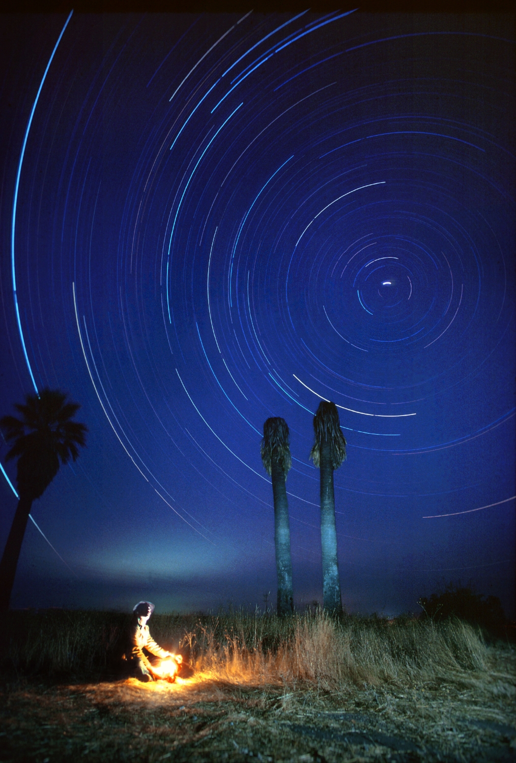  Due the Earth's rotation during a four hour exposure, the stars appear to spin around Polaris (the north star) in Lincoln, CA. 