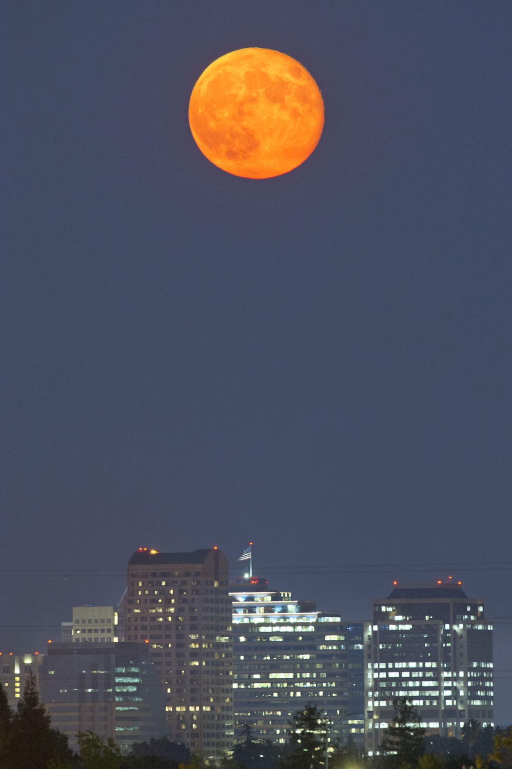  The "Supermoon" rises over the Sacramento skyline on Tuesday, September 9, 2014. When the moon's orbit brings it closest to Earth, or perigee, when it is full it is called a "Supermoon."&nbsp;&nbsp; 