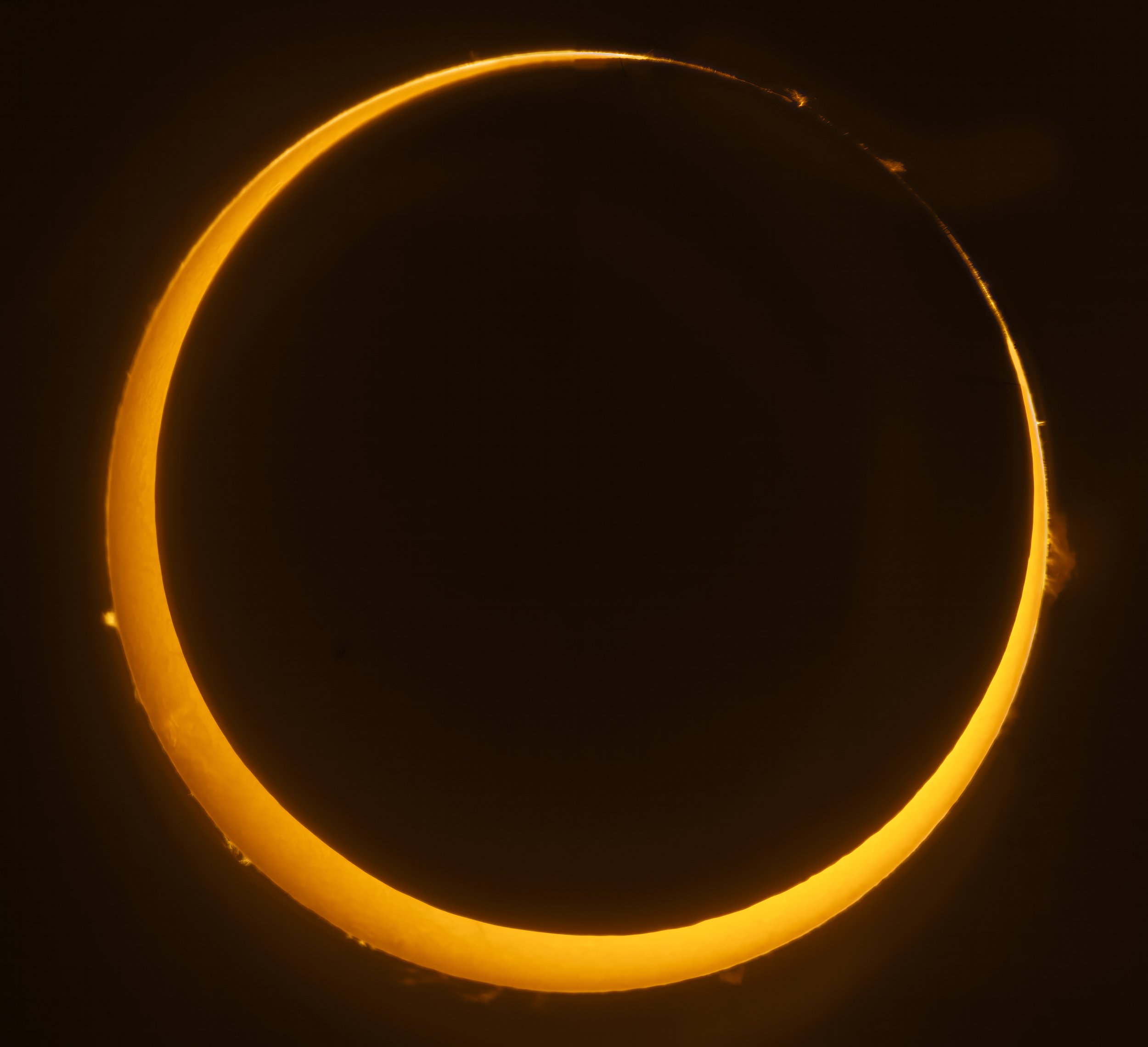  The Moon is silhouetted against the sun during an annular solar eclipse viewed from Jiggs, Nevada October 14, 2023. Unlike a total solar eclipse, during an annular eclipse the Moon is farther from the earth and does not completely obscure the Sun’s 