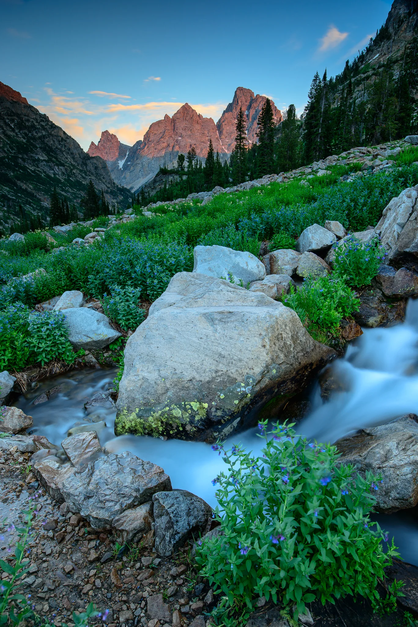 Looking south through Paintbrush Canyon as alpenglow illuminates Grand Teton peak.