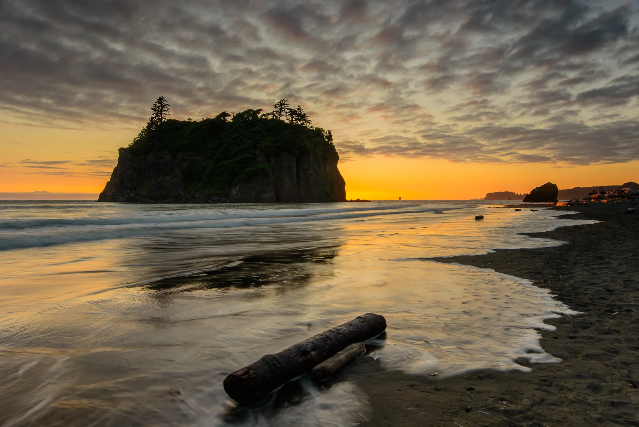 Summertime orange glows just above the horizon at Ruby Beach in Olympic National Park, WA.