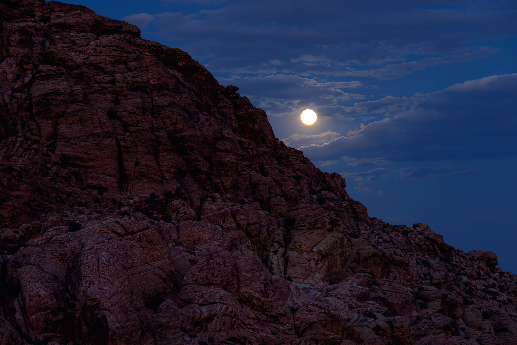 Oh hey moon! A pleasant peak at the full moon rising. Red Rock National Conservation Area, NV.
