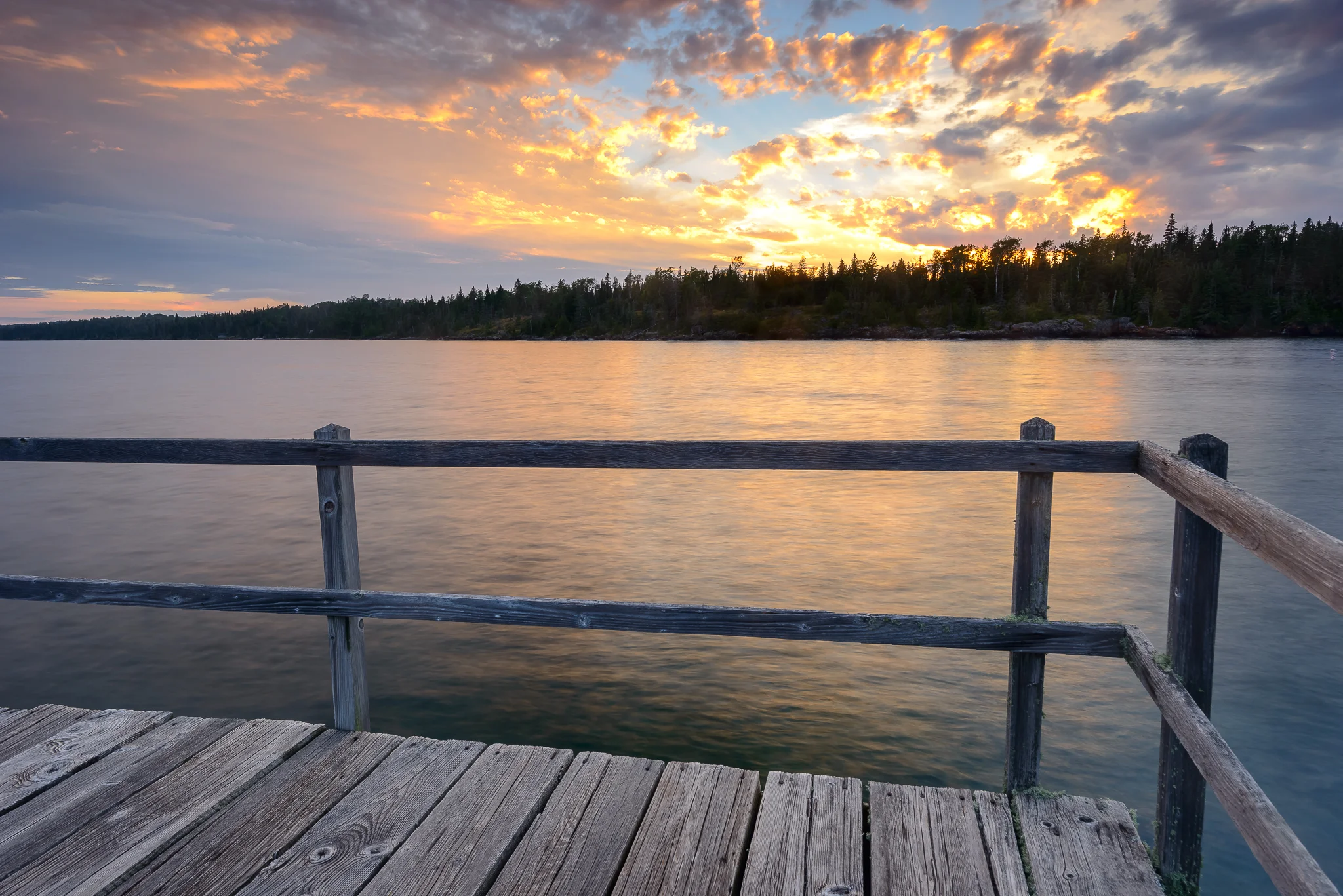 With a reputation thriving on fog and overcast skies, I felt super lucky to have landed even one sunset show. Rock Harbor, Isle Royale, NP.
