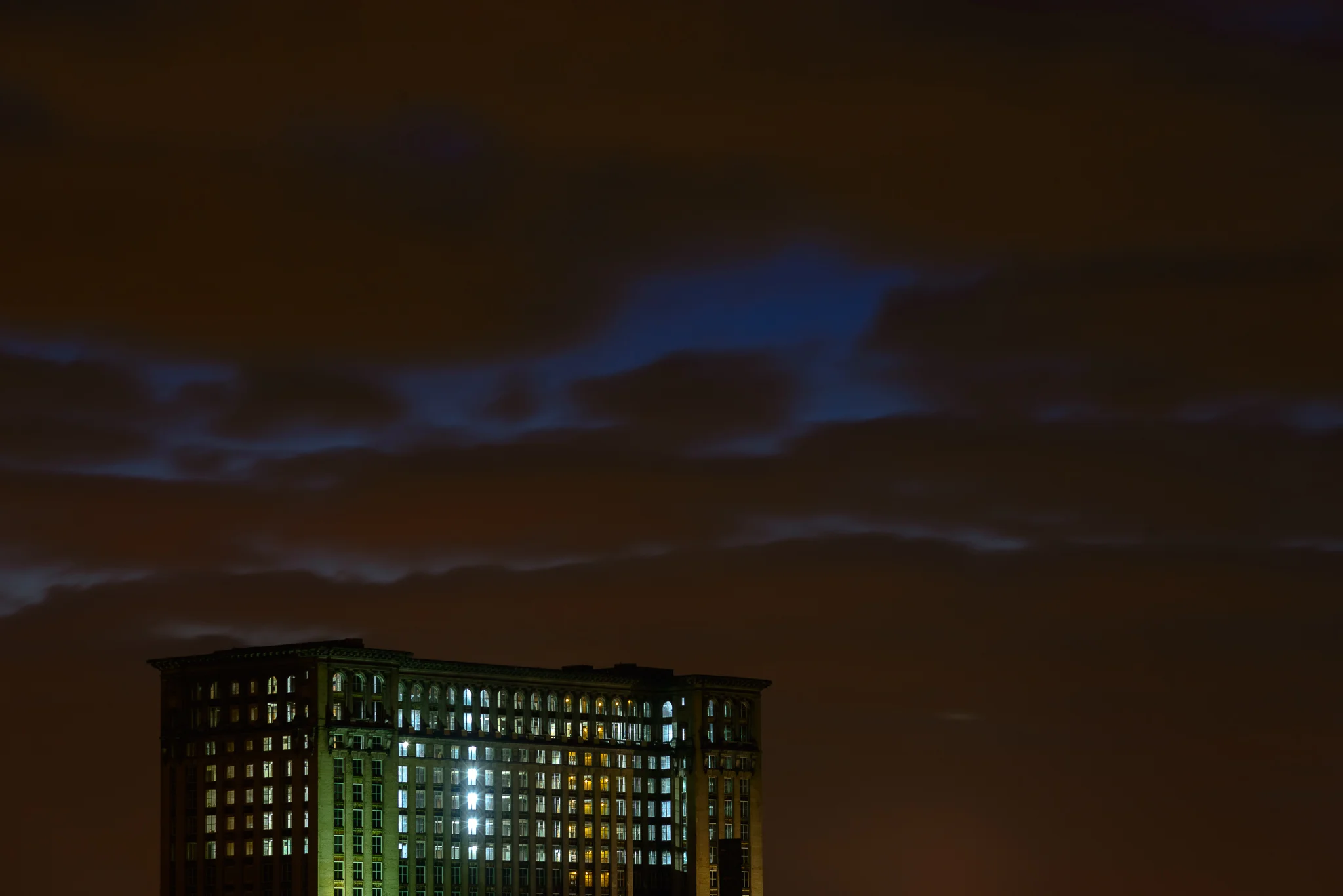 detroit_michigan_central_lights_on_clouds.jpg