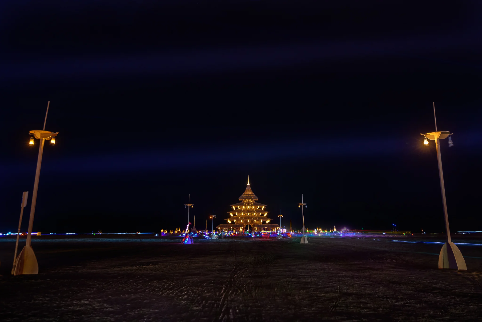 Soft glows in the distance paired with sky piercing lasers. Yup, sounds about right. Black Rock City, NV. 