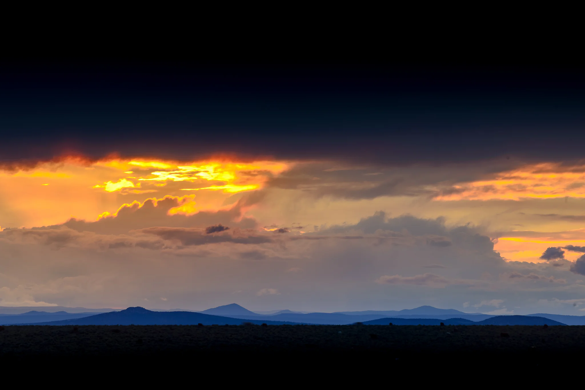taos_open_field_sunset_black_bars