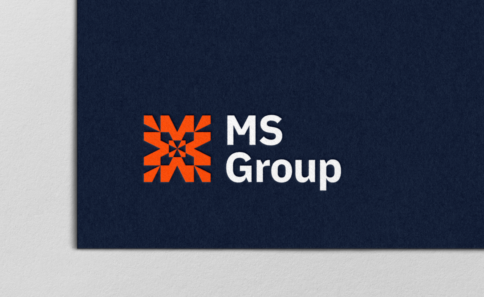 MS Group logo with red geometric design and white text on navy background.