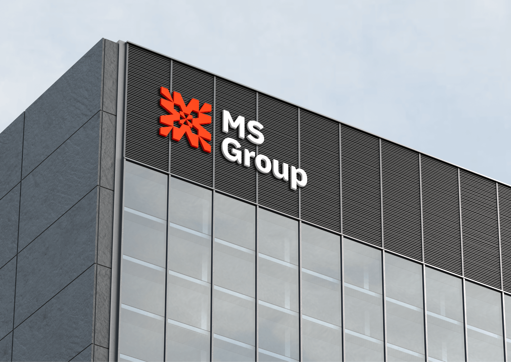 Modern office building with MS Group sign and logo at the top corner.