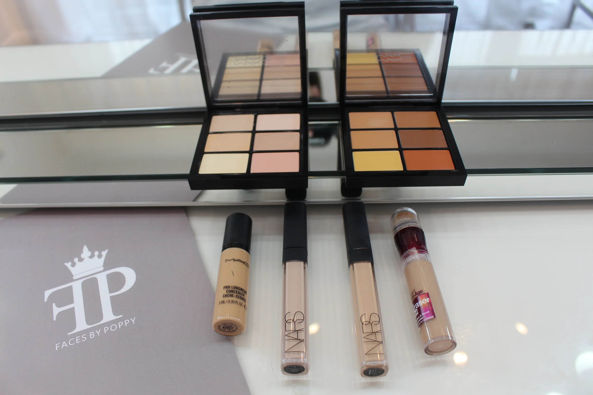 Top : Mac Cosmetics concealer palettes in Light and Medium. Left to right: Mac pro-longwear concealer in NC25, Nars creamy concealer in Vanilla, Nars creamy concealer in Custard and Maybelline Perfect and Cover concealer in nude. 