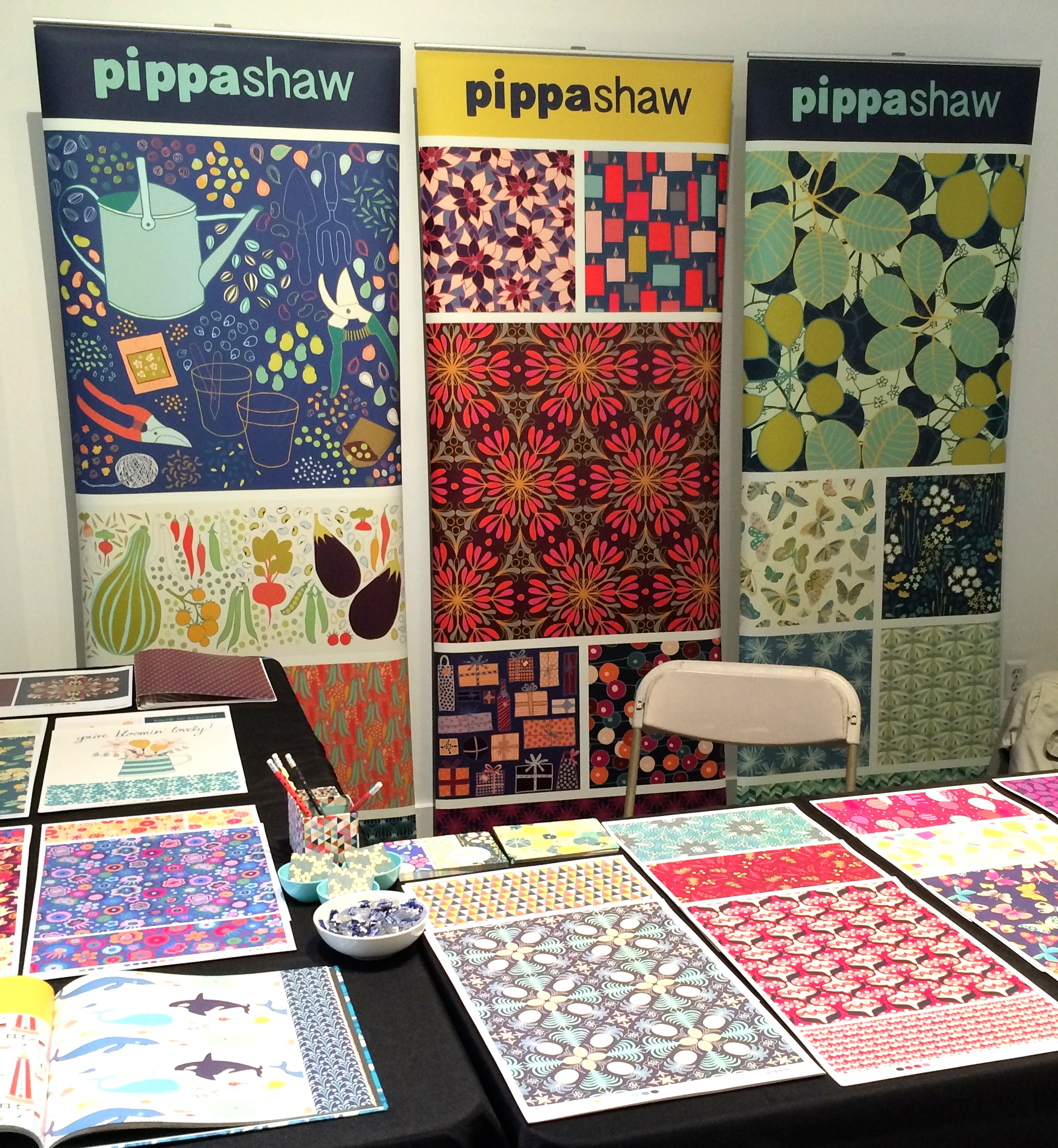 my booth all set up and ready to go! You can spot my portfolio book (bottom left) showing collections, and my presentation sheets separated into categories