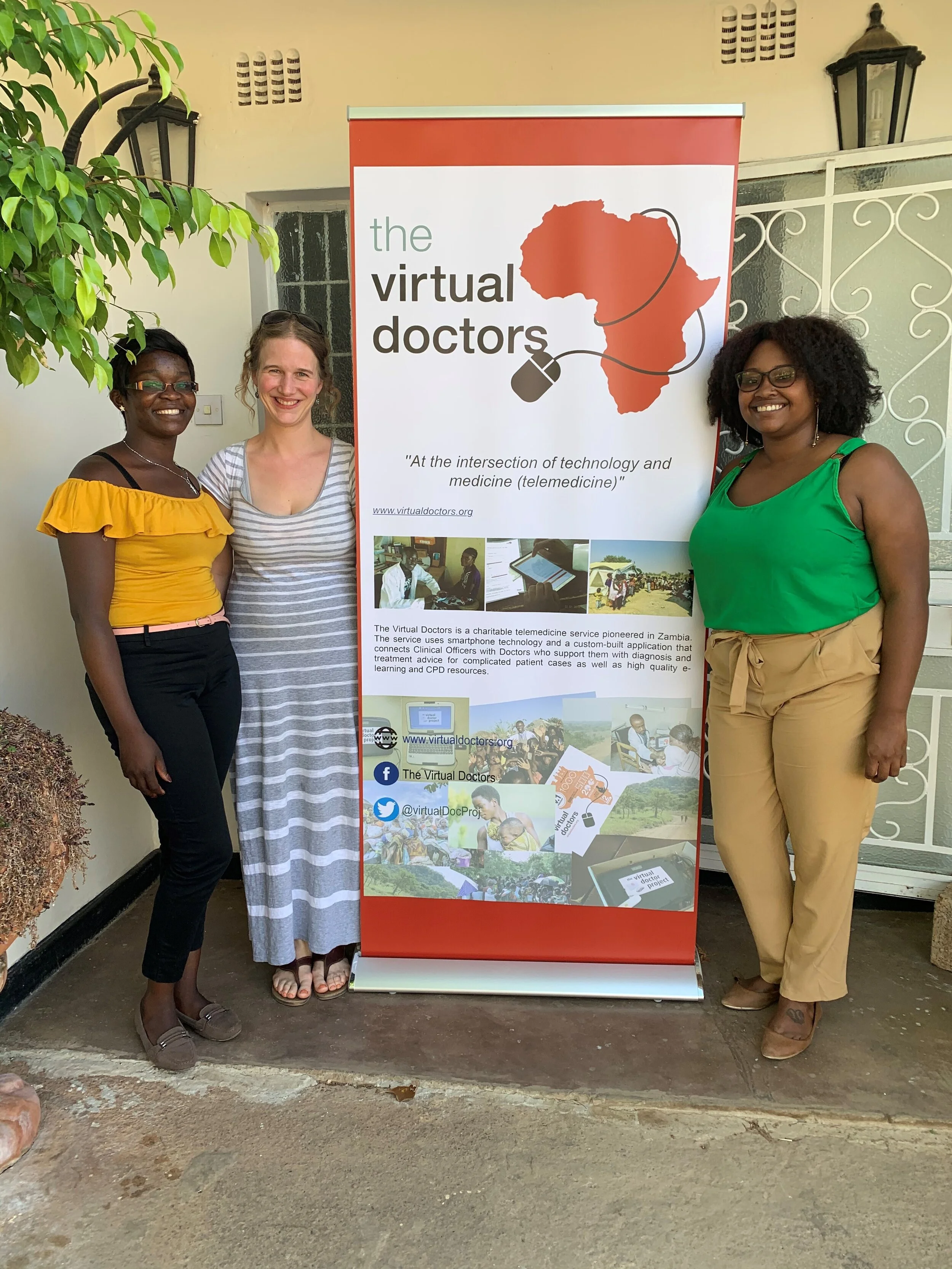Left to right: Stellah Chilembo (VDrs Field Assistant), Nikki Hall (VDrs volunteer Ophthalmologist) and Shakerrie Allmond (Director of VDrs Zambia) outside the VDrs office in Kalundu