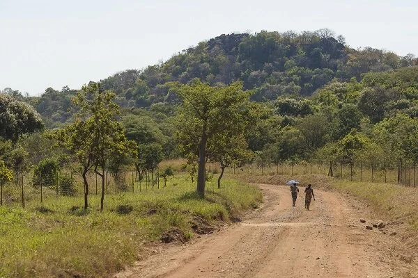 2 women walking down a dirt road.jpg