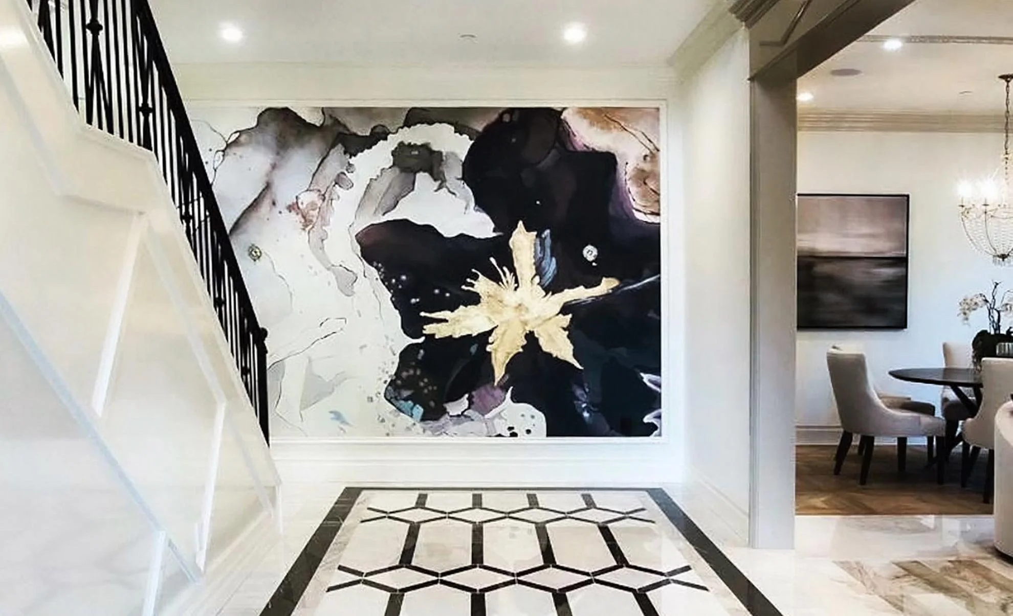 Entry mural of abstract flower with watercolor effect and gold leaf.