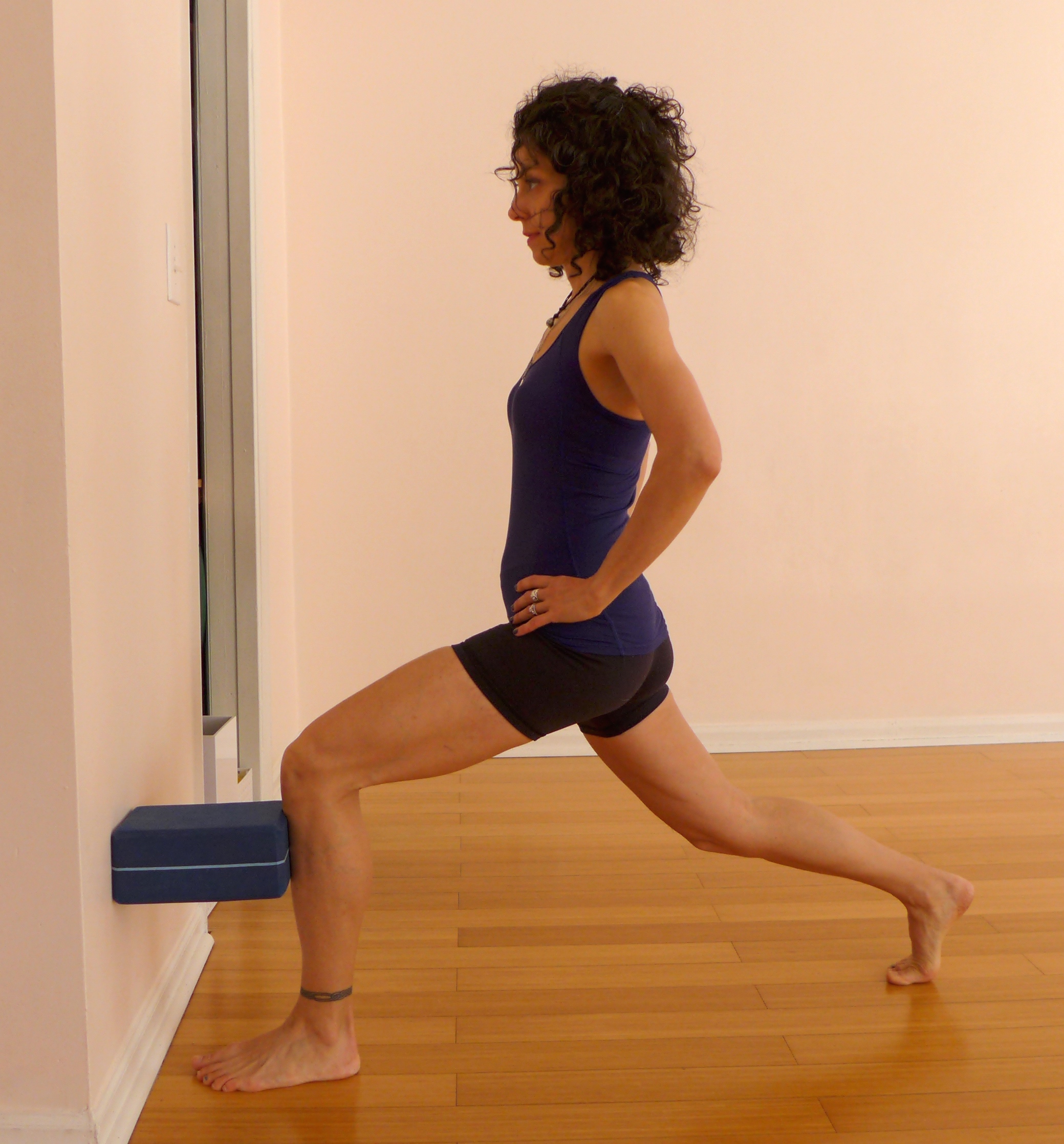 6. LUNGE WITH A BLOCK AT THE WALL
