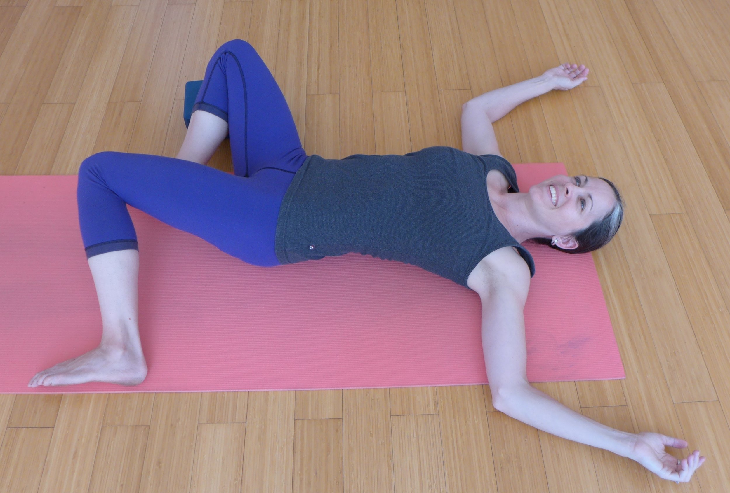 Easy Open Twist: When you set this up, have your feet as wide as the mat. Use a block under the outside leg to support the hip here.