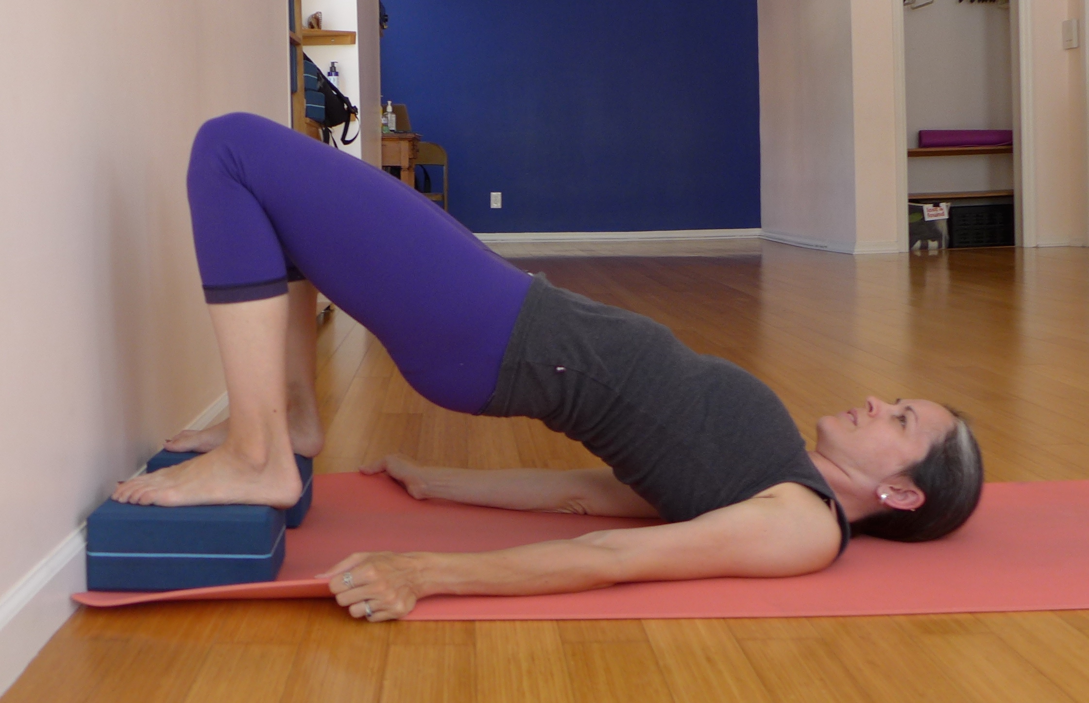 Bridge Pose: You will wait at least 24 weeks before you begin to do work like this. Although this is classified as a back bend and you will be advised from doing back bends, the way we have this set up takes the "bend" out of the back and allows you to effectively use the power of your legs and gluts to help you connect to your core.