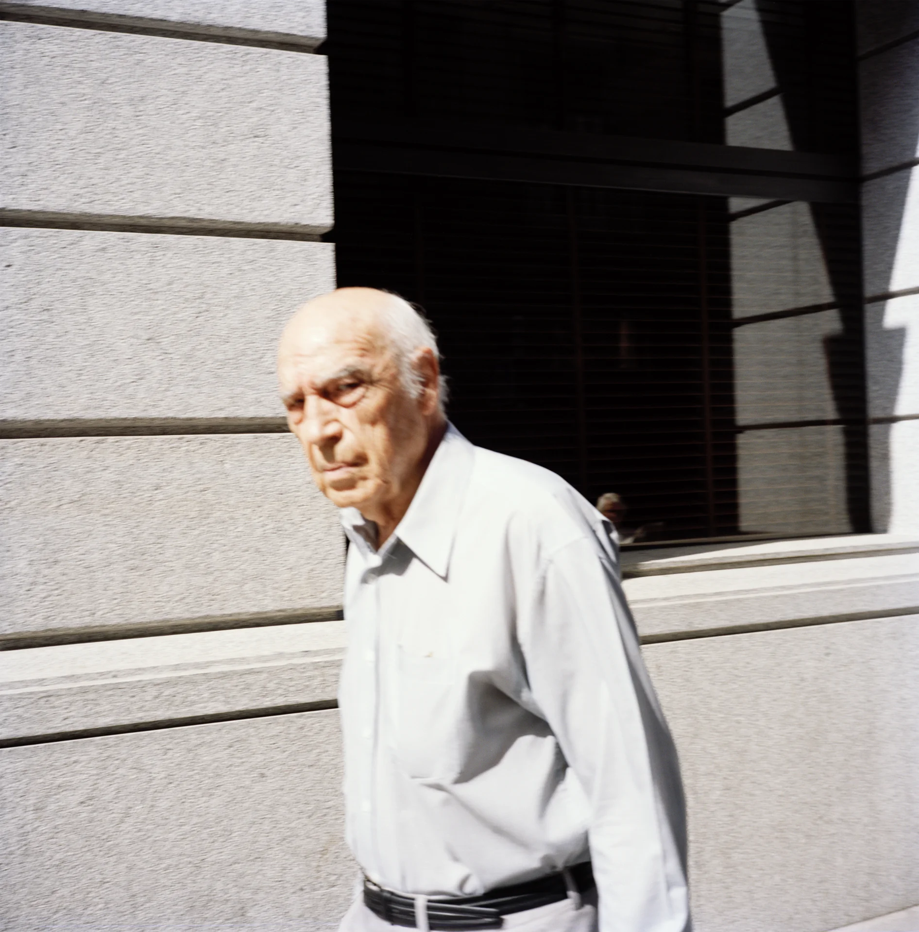 11:00 Having set up my mobile phone to alert me a minute before each hour, I was ready at 11:00 to photograph (as spontaneously as possible) whatever or whoever was in front of me. On my way to the first portfolio review of the day I encountered this older gentleman. He didn’t appear too happy to have my camera shoved in his face as he crossed my path – I imagine despite his obvious irritation that he never thought about incident again. I, on the other hand, have this lovely picture to show for it.