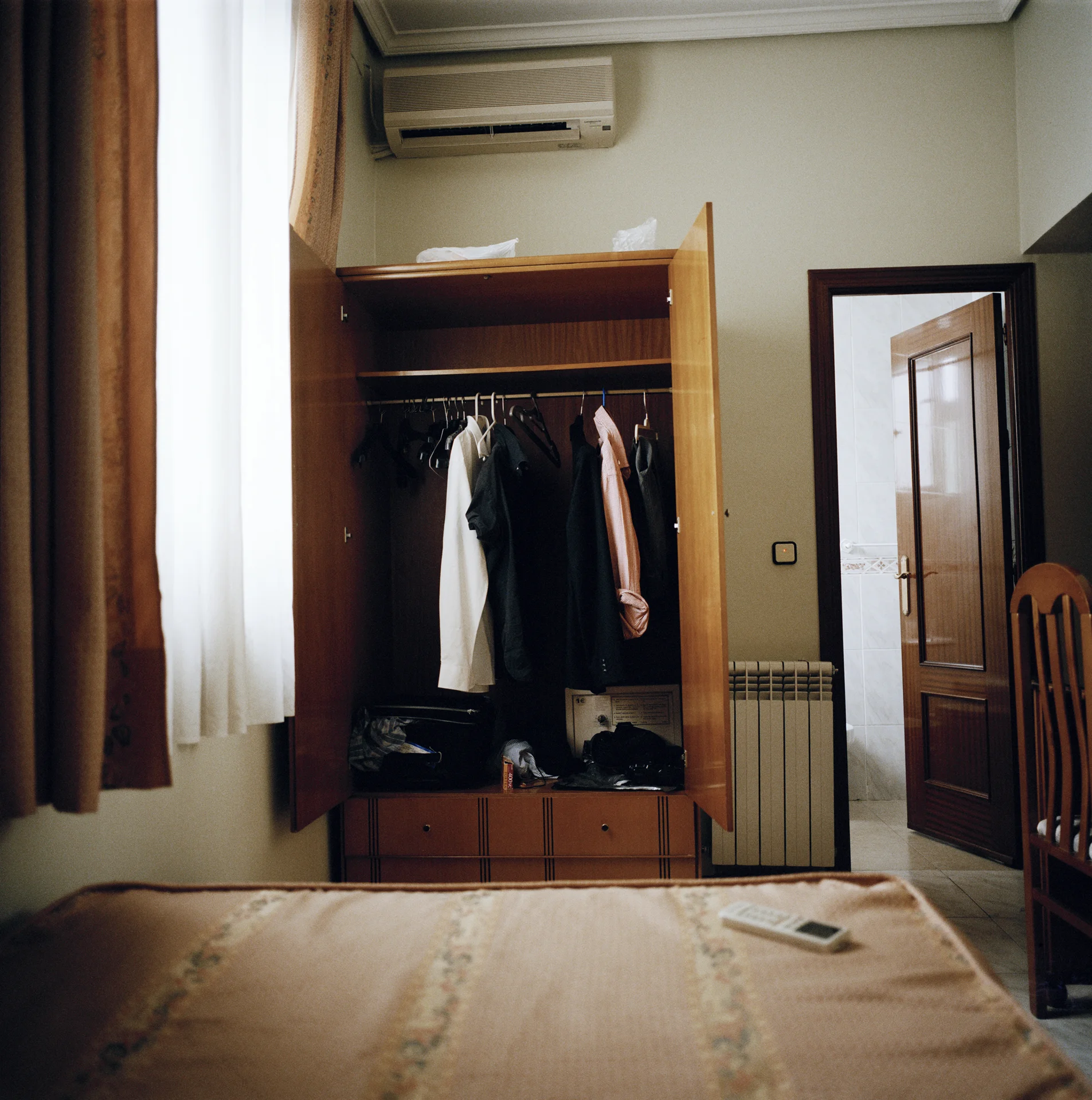 16:00 Back at the Hostel Martin in my uninspiring, but perfectly functional room. It was siesta time and I felt too lazy to photograph anything other than what was facing me – my closet.