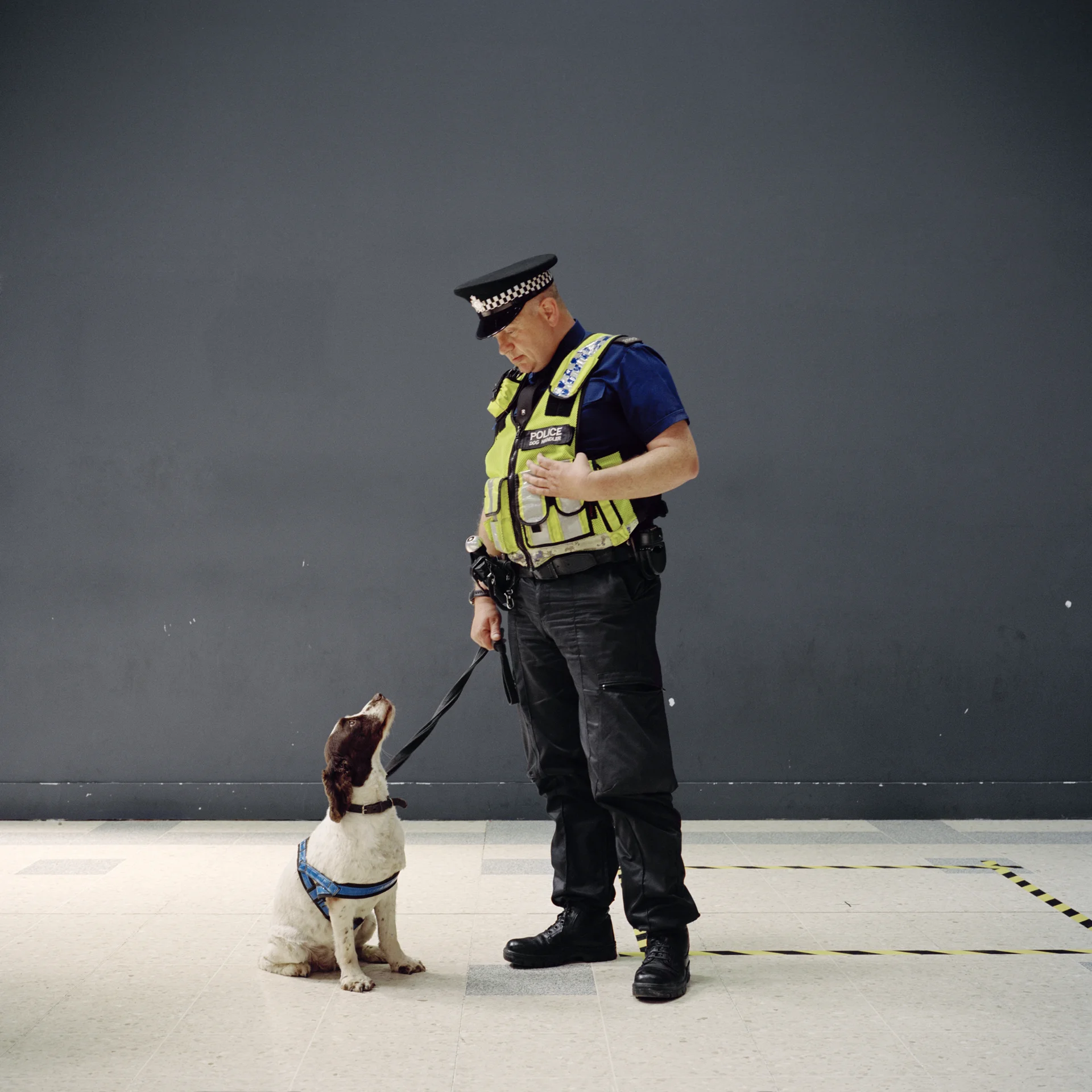 Police man and his sniffer dog