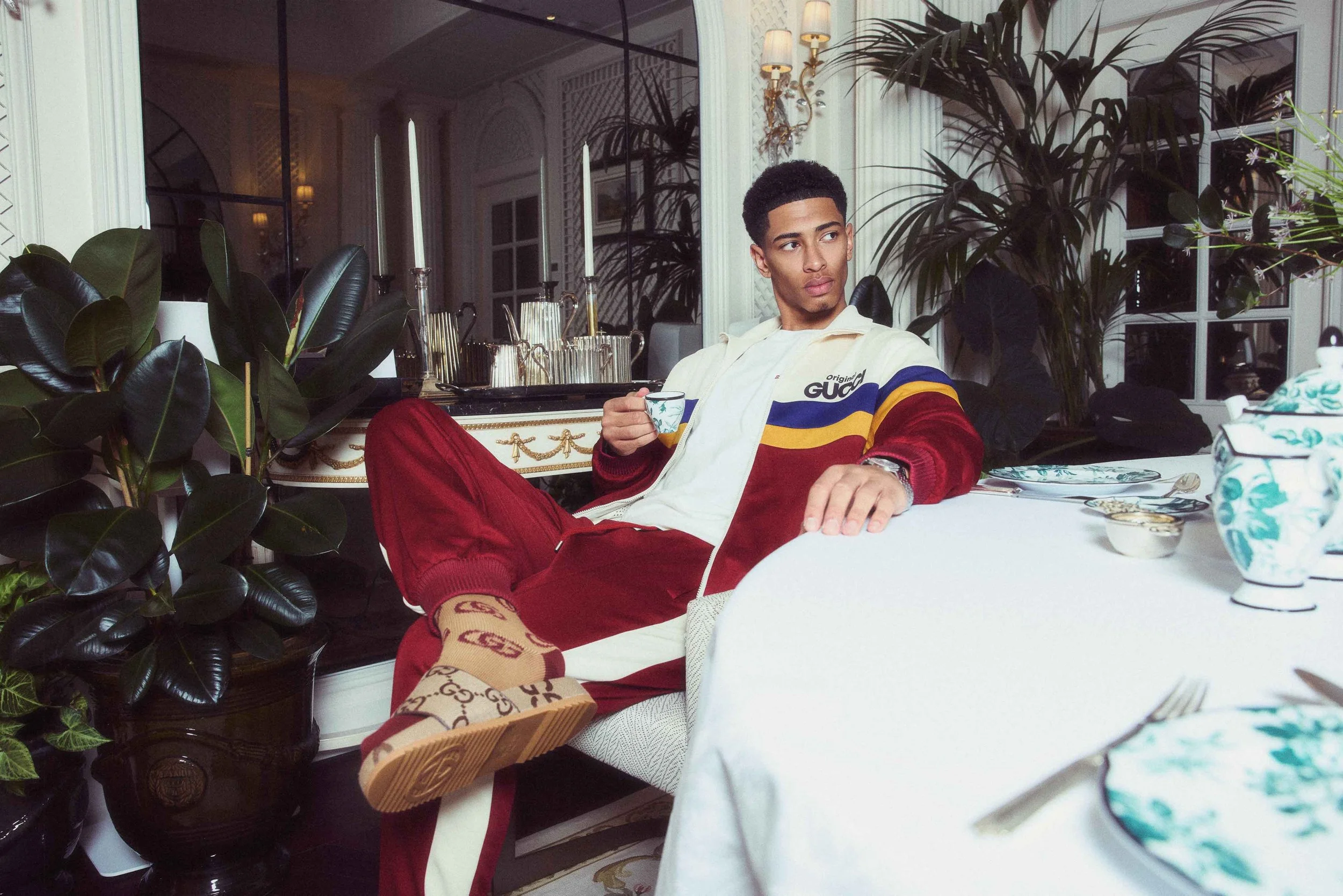 Jude Bellingham photographed in the Savoy hotel 'GUCCI room' drinking tea.