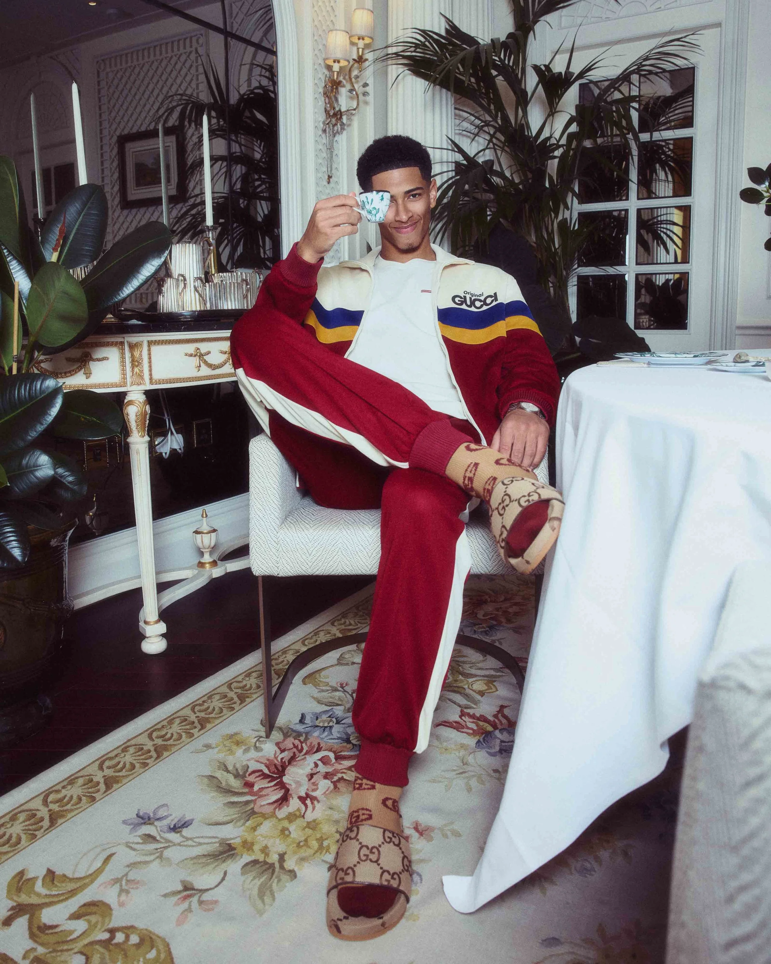 Jude Bellingham photograped in the Savoy Hotel 'GUCCI' room taking afternoon tea.
