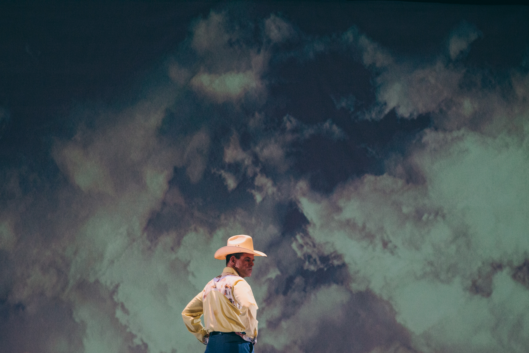 BUM PHILLIPS Commissioned and produced by Monk Parrots (New York) Music by Peter Stopschinski Libretto by Kirk Lynn Direction and Production Design by Luke Leonard Photos by Corey Torpie Photography All rights reserved, Copyright 2014 "a tour de force...undoubtedly - a fine evening's entertainment." - New York Times "This is not your typical night at the opera...unique, audacious, quirky, a proud underdog striving to succeed on its own terms." - USA Today Sports "The opera world would be wise to take notice of Bum Phillips. It's exactly that kind of opera that can build bridges to non-traditional audiences." - Maxamoo "You're in for a treat 'cause there's a lot of talent on view in this production...The music by composer Peter Stopschinski is stunning...it's bound for even bigger venues and accolades." - The Artsy Voyager This world premiere opera celebrates the improbable life of Bum Phillips, a National Football League legend and American icon. Inspired by Phillips' motivational skills and homespun principles, this epic portrait of Bum Phillips pushes the boundaries of where and for whom opera is staged. This new work from Monk Parrots features composition from Peter Stopschinski and a libretto by Kirk Lynn, both members of the award-winning theatre collective Rude Mechanicals. Production History Texas Premiere September 24, 2015 The Stafford Centre, Stafford, Texas World Premiere March 12-30, 2014 La MaMa Experimental Theatre Club, New York