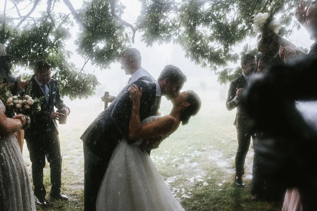 It’s funny how everyone around them is fighting off the rain, but Carly + Matt don’t seem to mind one bit.