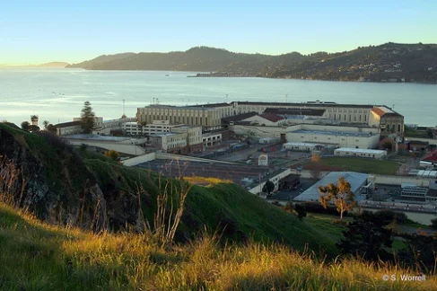 The sun creeps up over the walls of San Quentin Prison