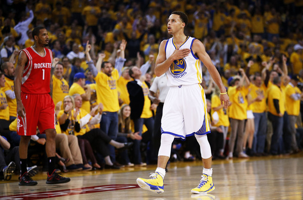 Golden State Warriors guard Damion Lee, right, pours water over the head of  guard Stephen Curry (30) while celebrating Curry's career-high 62 points  against the Portland Trail Blazers in an NBA basketball