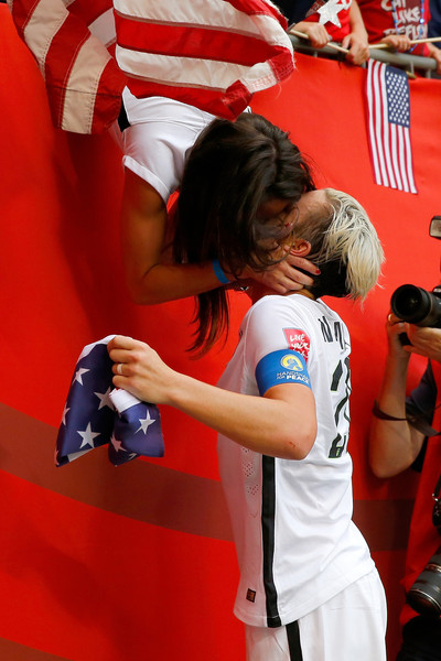 Abby Wambach kisses her wife following the the World Cup Final vs. Japan (photo by Kevin C. Cox)