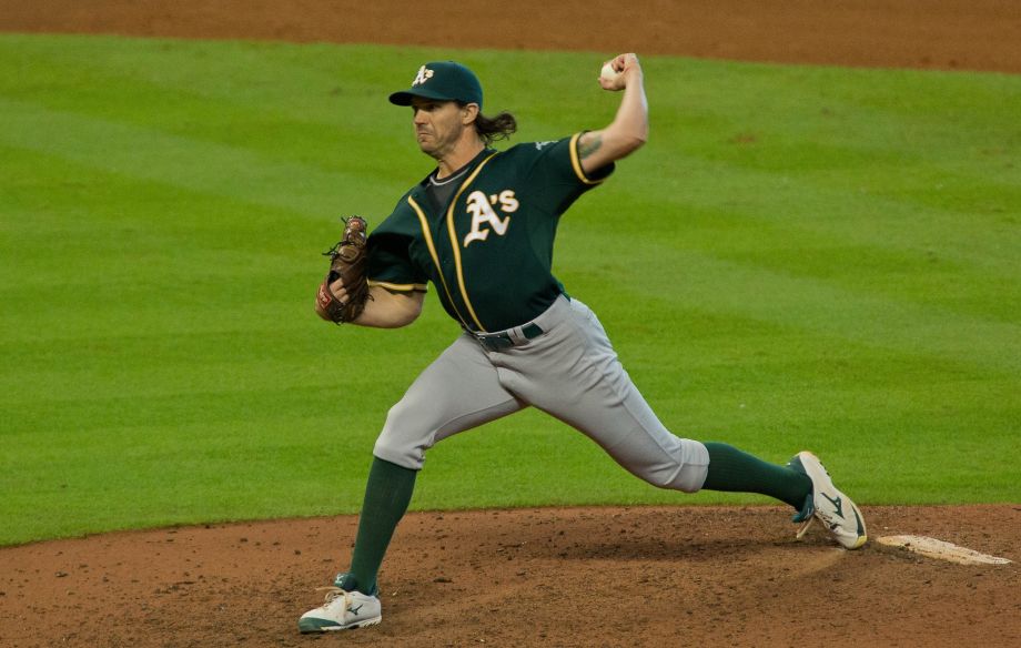 Zeets slinging his patented curveball in his first game back with the A's versus Houston (Photo by Richard Carson)