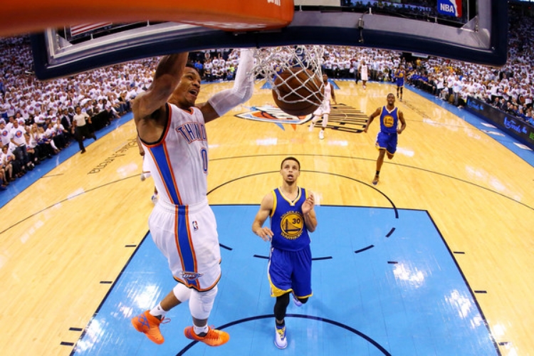 Russell Westbrook registered a 36 point triple-double on Tuesday. Steph Curry finished with 19. (Photo by Ronald Martinez)