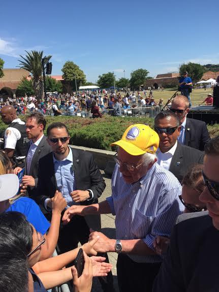 Bernie was at Game 7 to watch the Dubs win the Western Conference title on Sunday. On Friday in Fairfield, Sanders wore his Warriors hat on the campaign trail. (photo by Skaz One)
