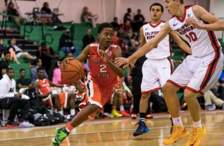 Charlie running the point for the Mac Irvin Fire, one of the top AAU programs in the country. (photo courtesy of MacIrvin.com)