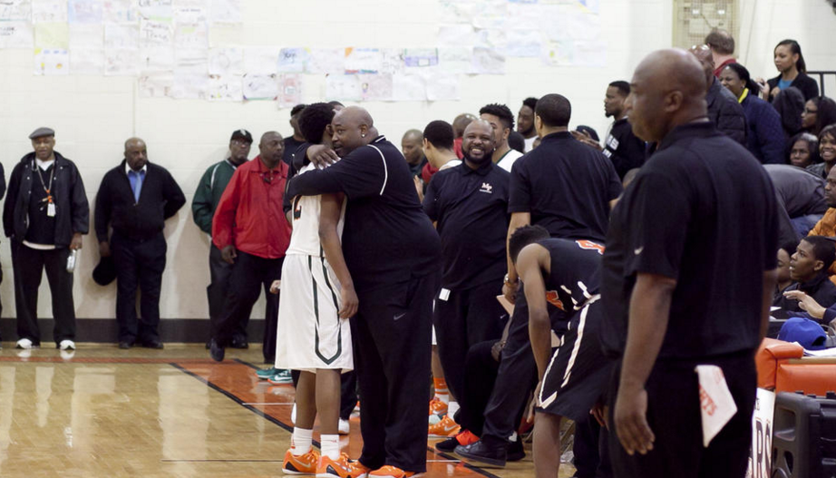 Charlie receives a hug from his high school coach, Nick Irvin. (photo by Eddie Quinones) 