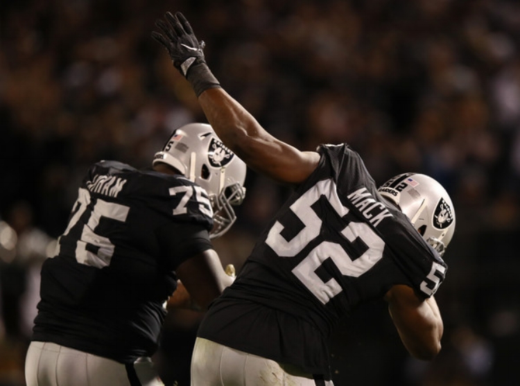 Dabbing on the AFC West (photo by Ezra Shaw) 