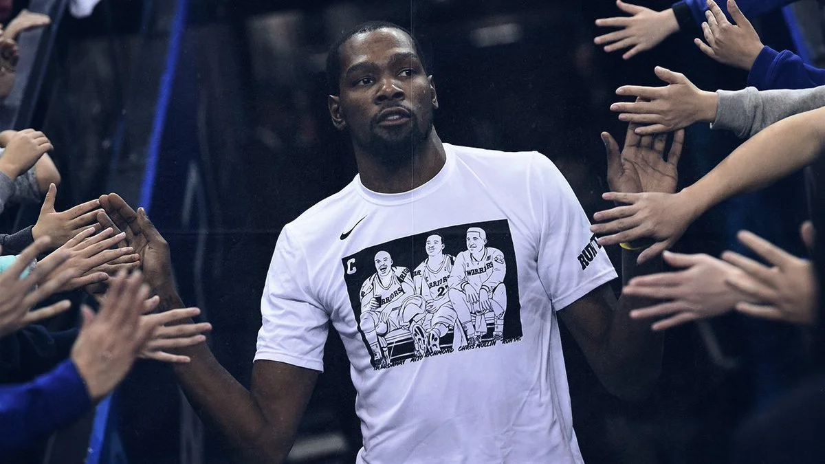 KD reppin’ RUN TMC. (Photo via Golden State Warriors)