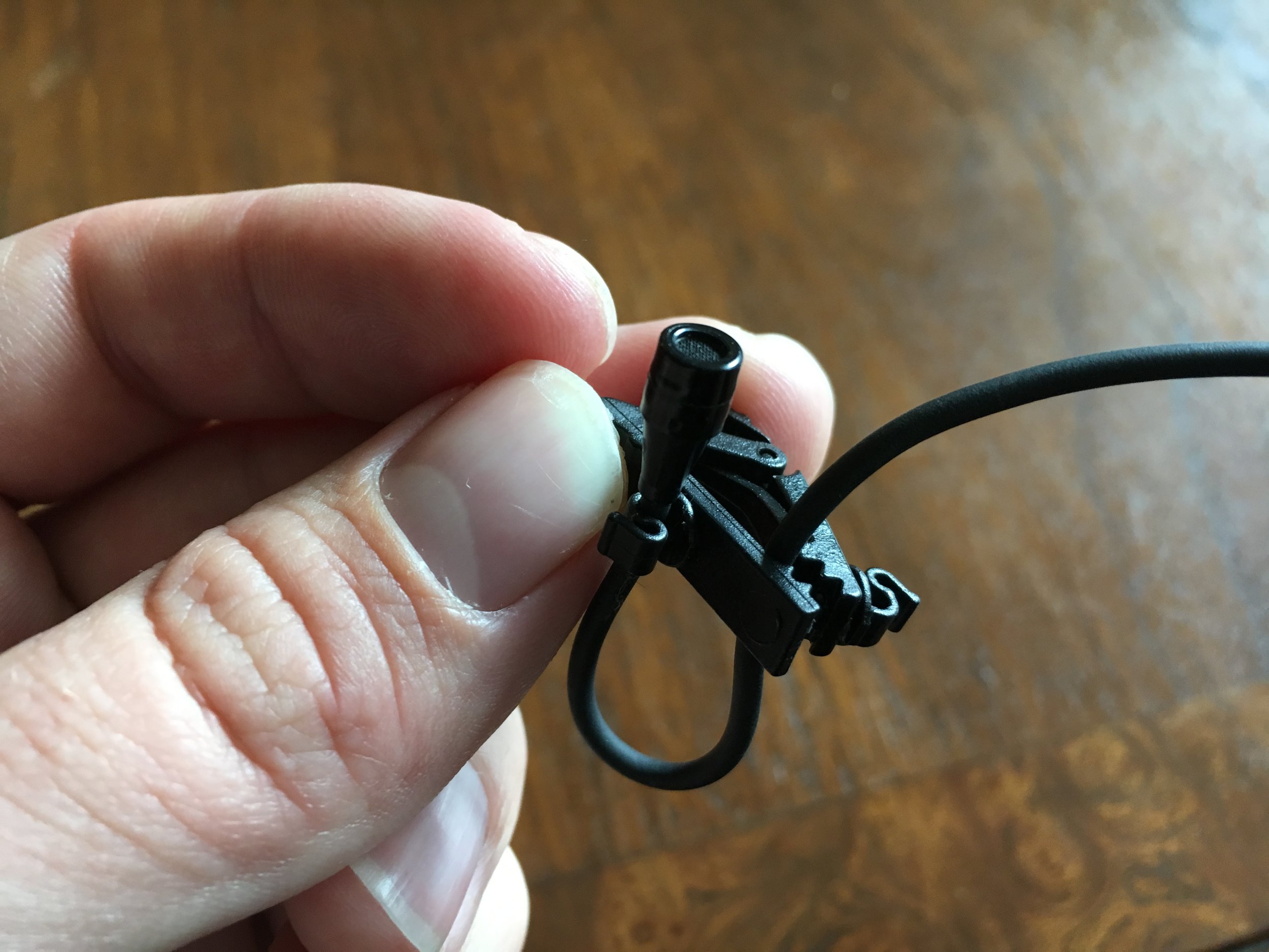 Step 2. Clamp the cable in between the clamp (not on it) so that there is a loop below the capsule. This is key to keeping things looking tidy. 