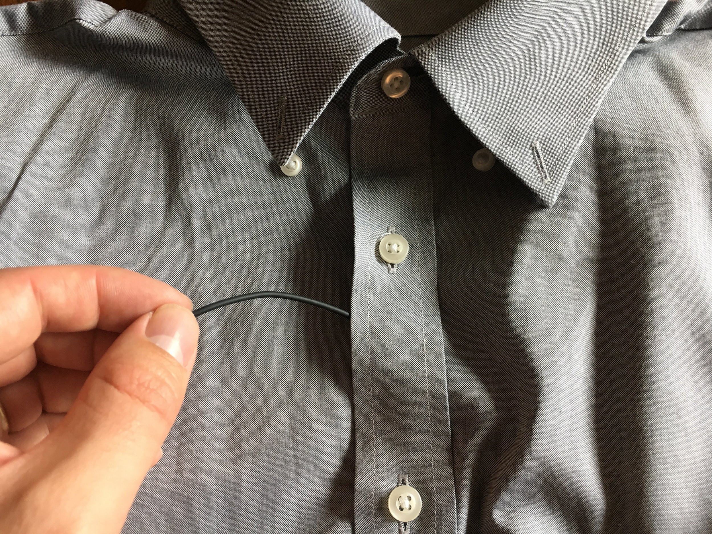 If you are miking a button up, slide the cable between the buttons at about the sternum on the chest. 