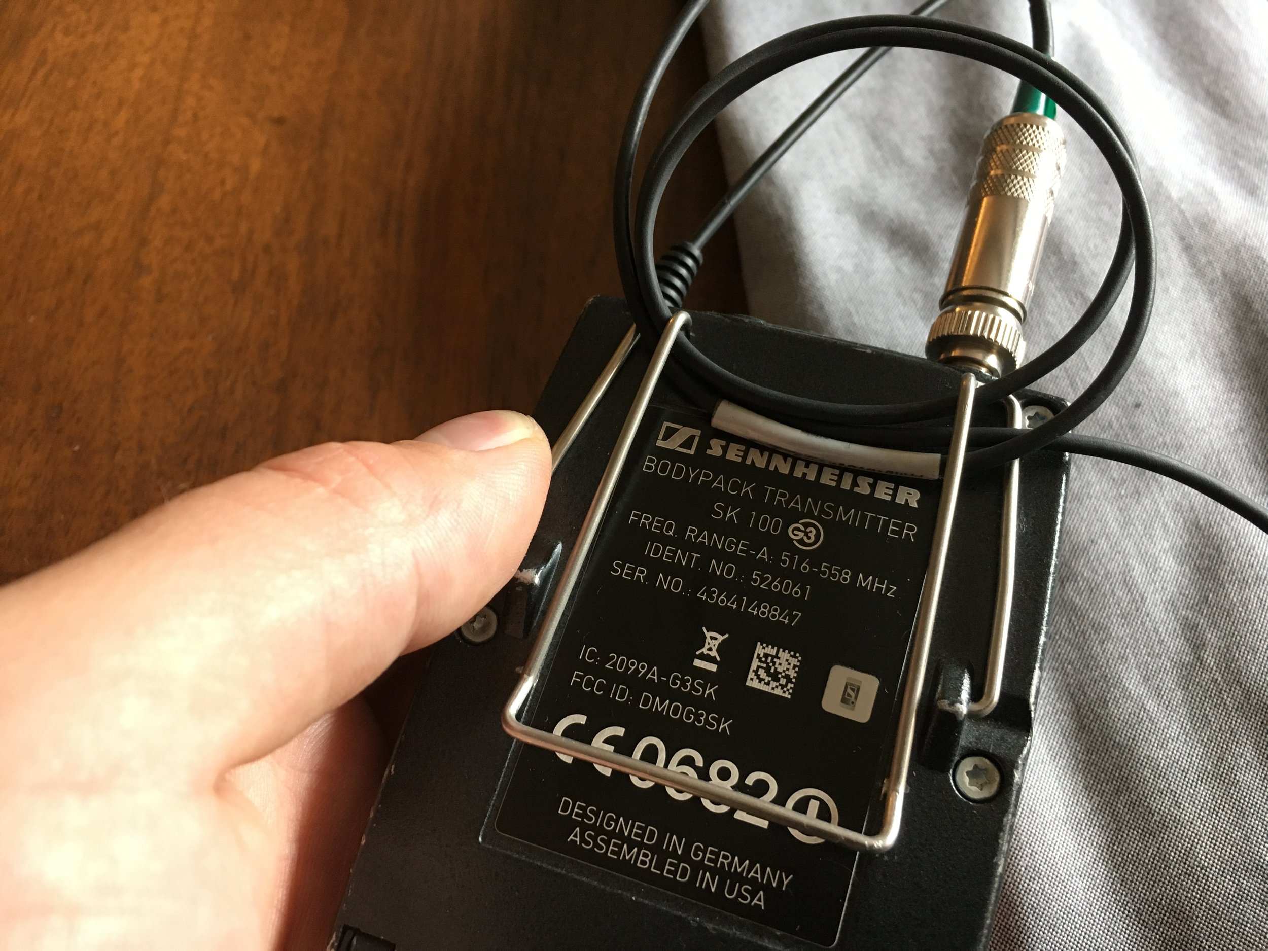 Step 6. Tidy up the leftover cable around the transmitter. I like to make a loop and sandwich it in the transmitter clip. After that, you're good to put the transmitter on a belt, waistband, pocket, etc. 