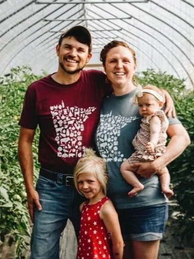 The Zimmerli Family pictured inside one of their high tunnels.