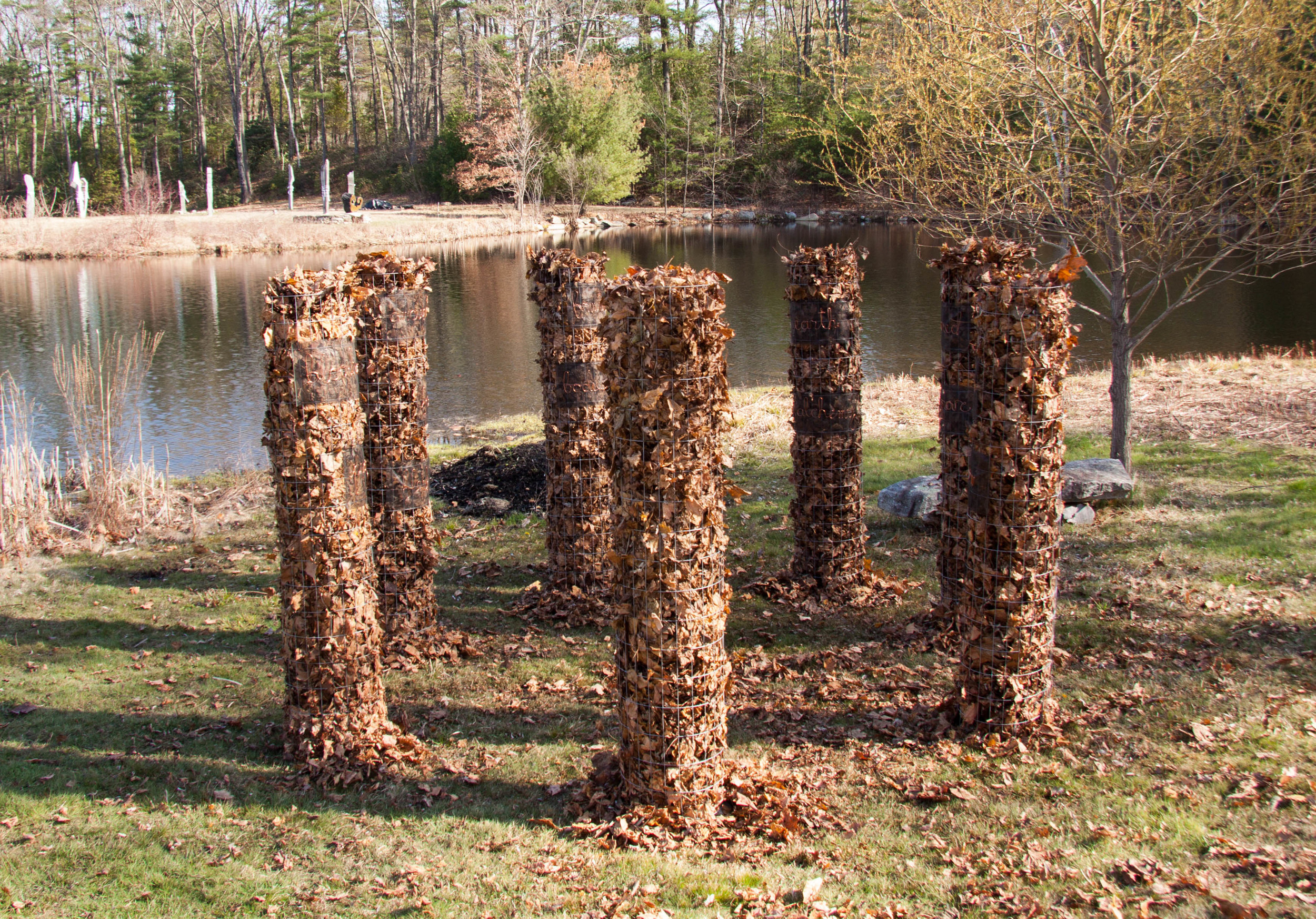 Temenos by Linda Hoffman and Gabrielle White installed at Old Frog Pond Farm with Medicine Wheel in the distance.