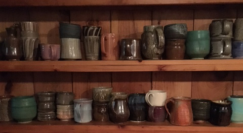 Mug , Alex Matisse, fourth from right on bottom shelf 