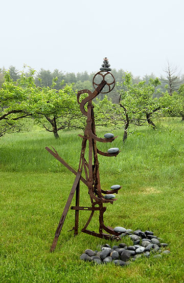 The Juggler in the Orchard , An old cultivator and river stones. Photo: Ricardo Barros