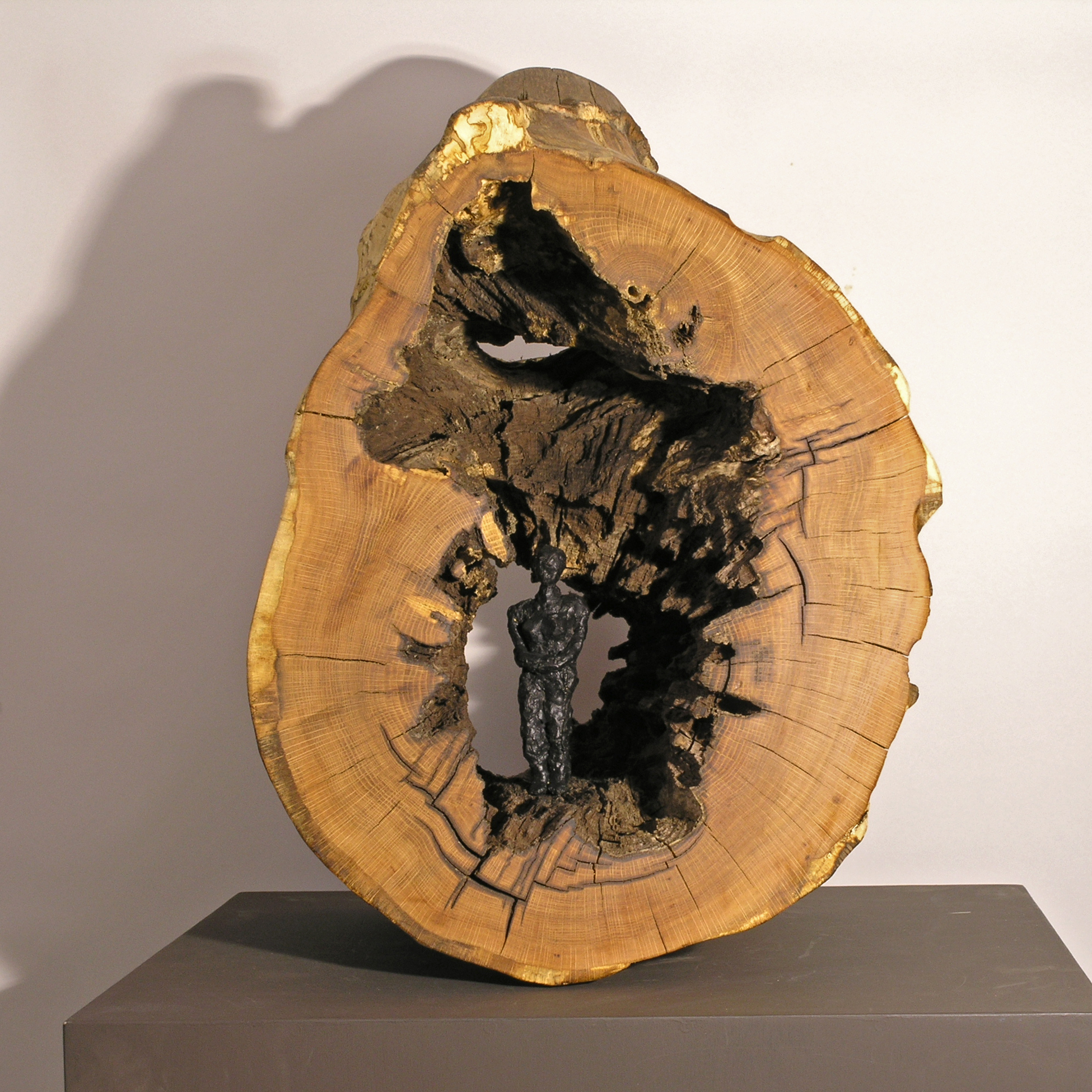 Woman in Log , bronze figure and wood, LH