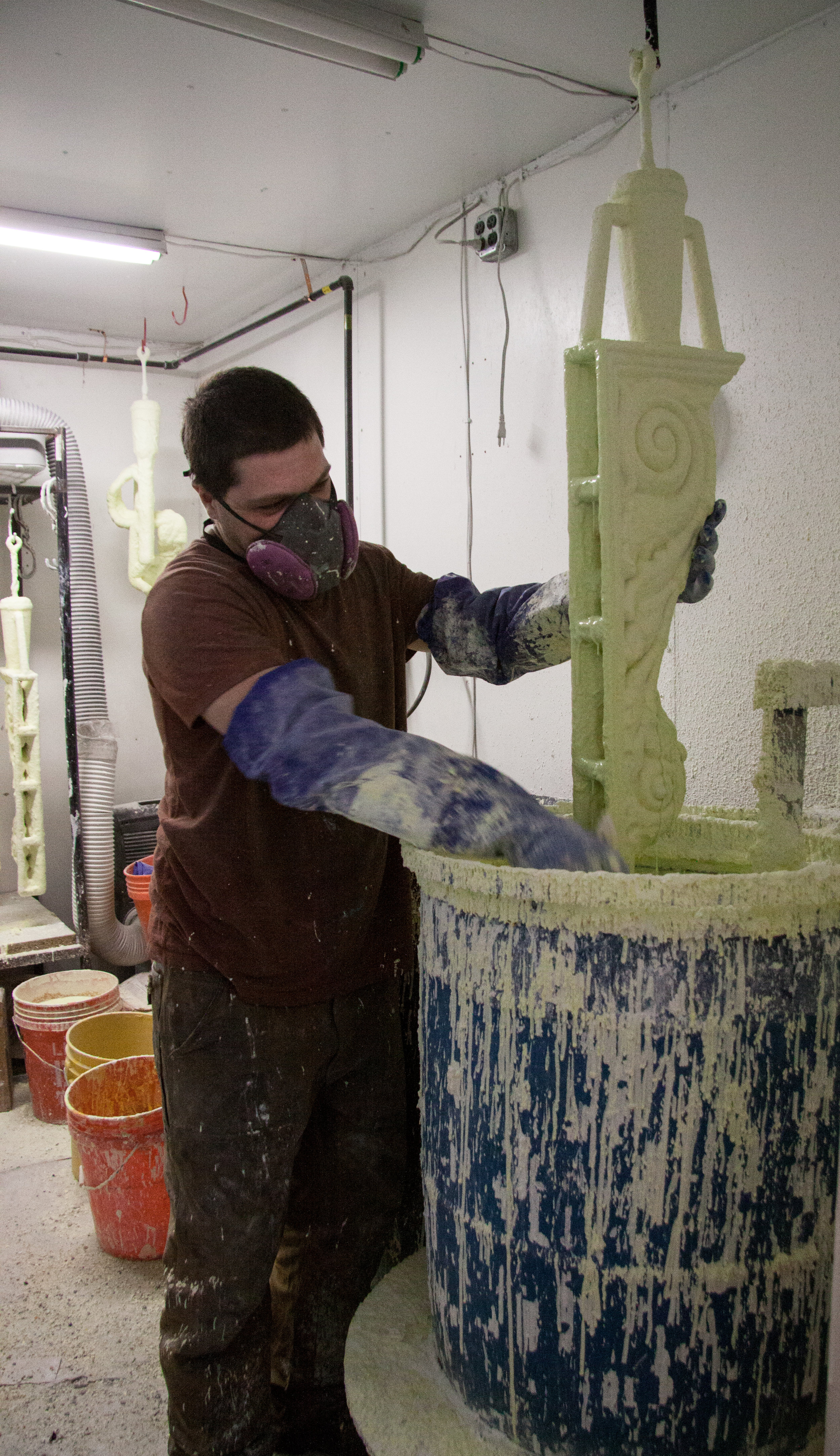 Dipping the wax to build up the ceramic mold.